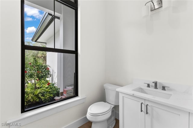 740 13th St NW, Naples, FL 34120 - half bathroom with vanity and wood finished floors