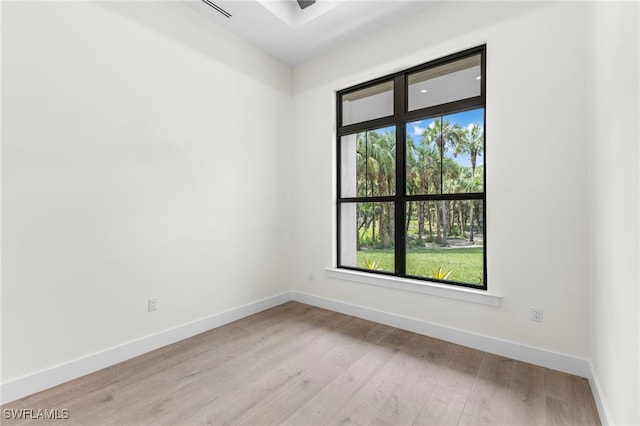 740 13th St NW, Naples, FL 34120 - spare room with light wood-style floors and baseboards