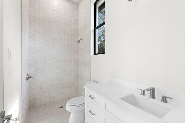 740 13th St NW, Naples, FL 34120 - bathroom featuring vanity, tile patterned flooring, and a tile shower