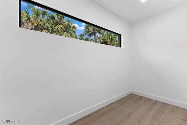 740 13th St NW, Naples, FL 34120 - empty room featuring light wood-style flooring and baseboards