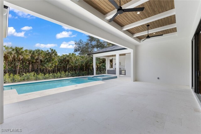 view of pool featuring a patio area, ceiling fan, and an in ground hot tub