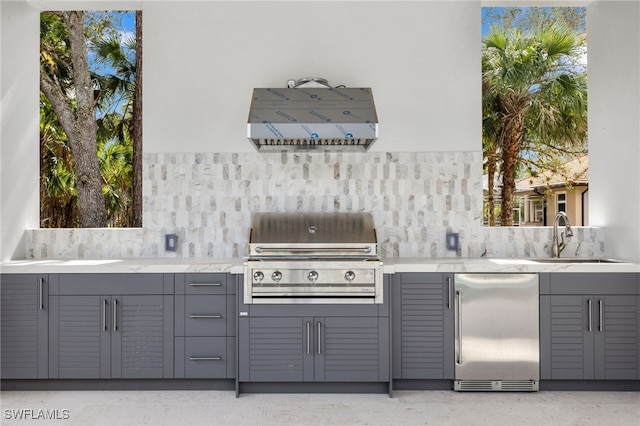 740 13th St NW, Naples, FL 34120 - view of patio with exterior kitchen and a sink