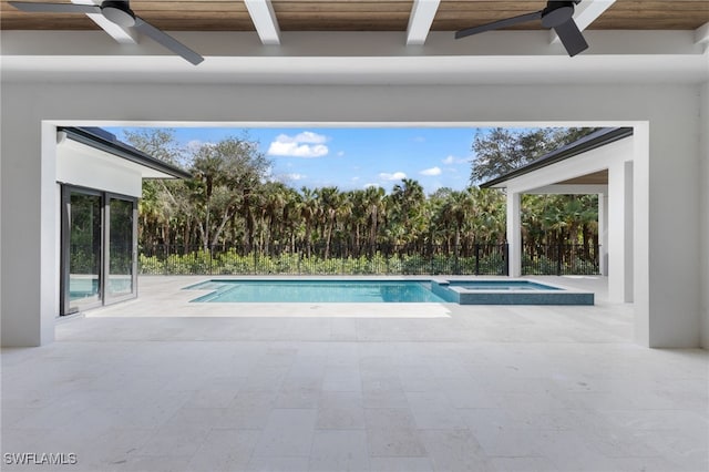 view of swimming pool featuring a patio, ceiling fan, and an in ground hot tub