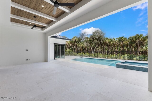 view of swimming pool featuring an in ground hot tub, ceiling fan, and a patio area