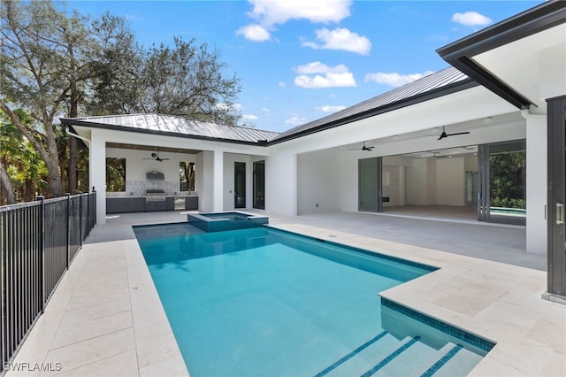 view of pool with grilling area, a patio, ceiling fan, and an in ground hot tub