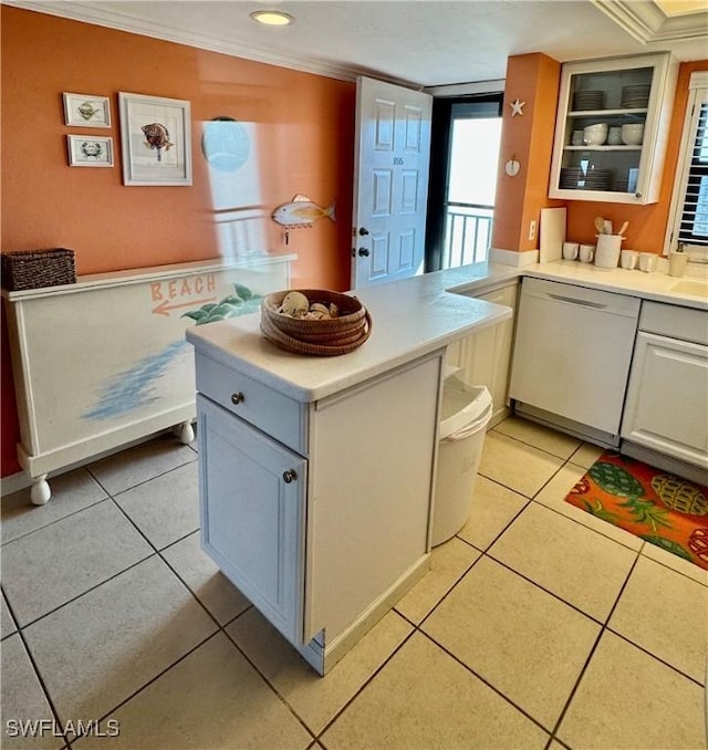 kitchen with white cabinetry, crown molding, dishwasher, and light tile patterned flooring