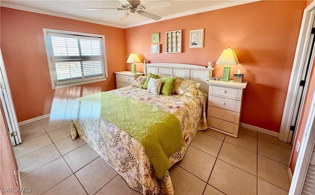 tiled bedroom featuring ornamental molding and ceiling fan