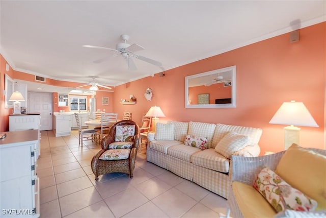 tiled living room featuring ornamental molding and ceiling fan