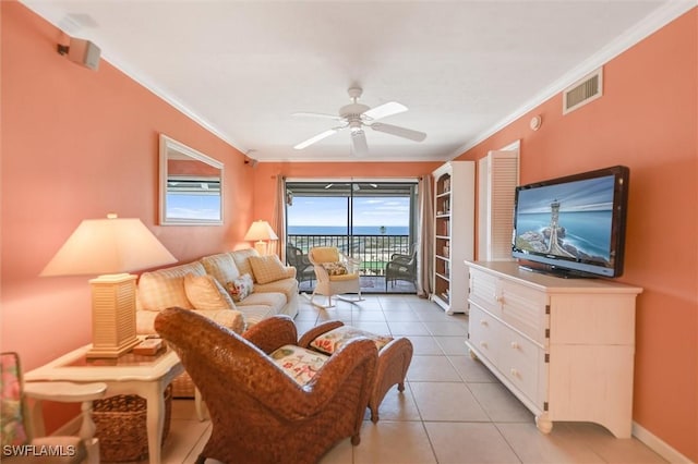 tiled living room featuring ornamental molding and ceiling fan