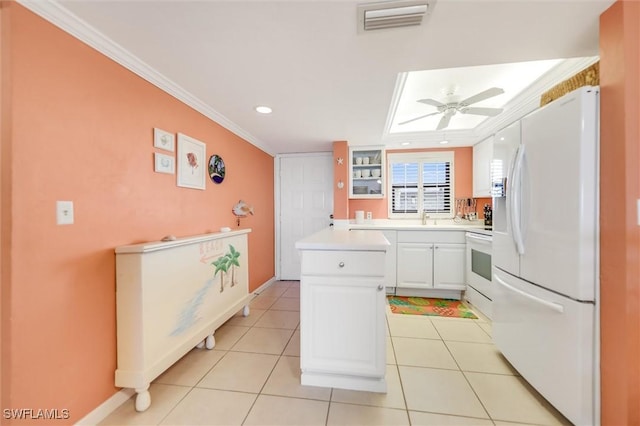 kitchen featuring white cabinetry, crown molding, light tile patterned floors, ceiling fan, and white appliances