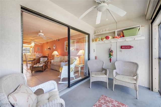 sunroom / solarium with ceiling fan