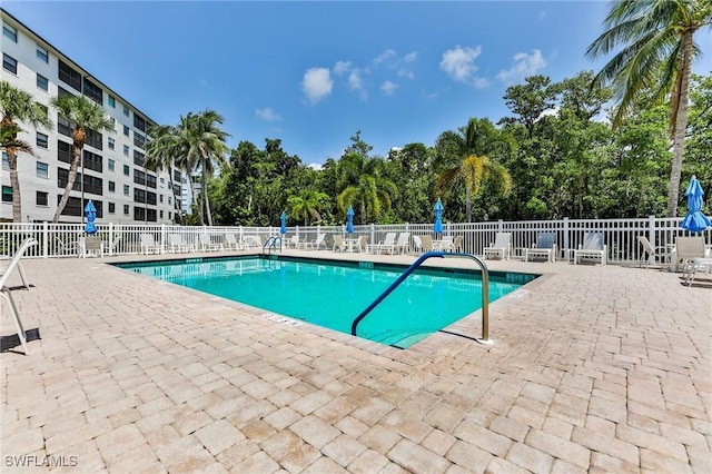 view of swimming pool featuring a patio area