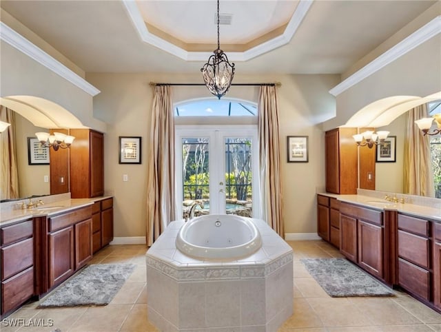 bathroom featuring tile patterned flooring, vanity, a notable chandelier, and french doors