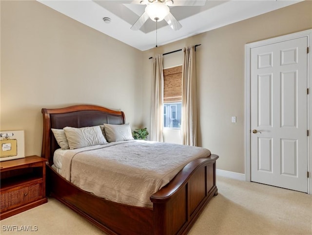 bedroom with light colored carpet and ceiling fan