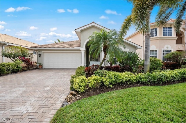 view of front of home with a garage and a front yard