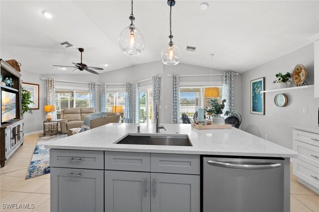 kitchen with a kitchen island with sink, hanging light fixtures, and stainless steel dishwasher