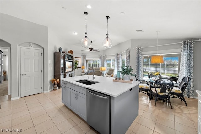 kitchen featuring sink, dishwasher, gray cabinetry, a center island with sink, and decorative light fixtures