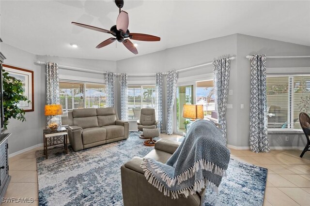 9109 Astonia Way, Estero, FL 33967 - living room with plenty of natural light, a ceiling fan, baseboards, and light tile patterned floors