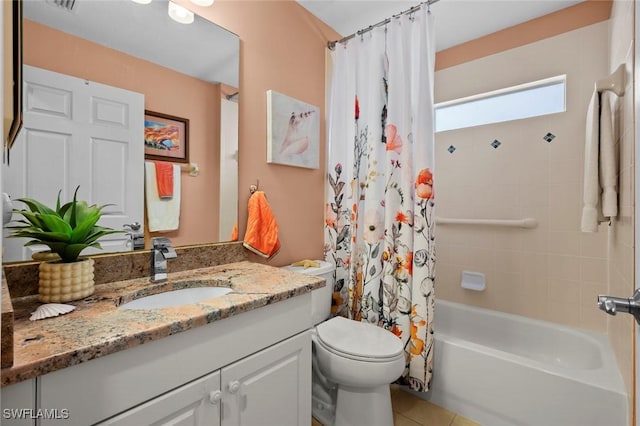 full bathroom featuring tile patterned floors, vanity, toilet, and shower / tub combo