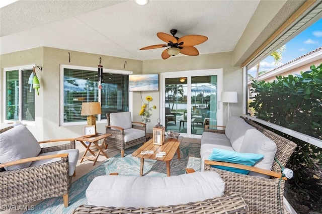 sunroom with vaulted ceiling and ceiling fan