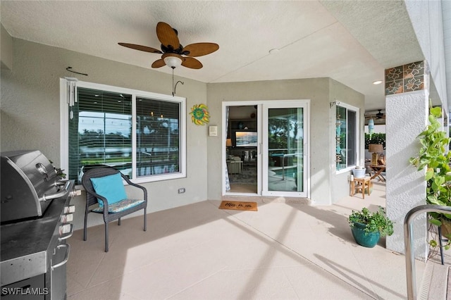 view of patio featuring ceiling fan