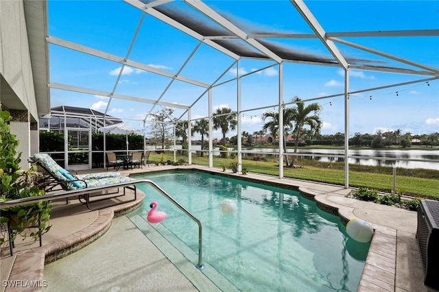 view of swimming pool featuring a water view, a patio area, and a lanai