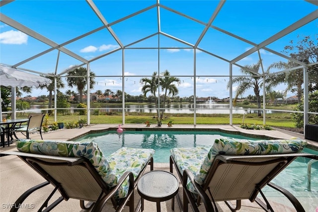 view of swimming pool featuring a lanai, a patio area, and a water view