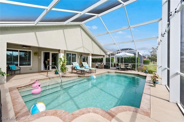 view of pool featuring ceiling fan, a lanai, an outdoor hangout area, and a patio