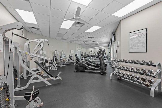 exercise room featuring a paneled ceiling and visible vents