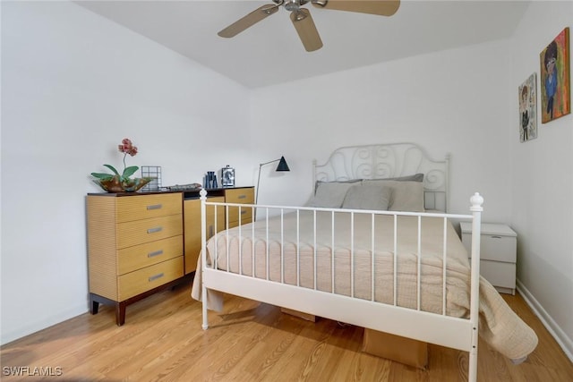 bedroom featuring wood-type flooring and ceiling fan