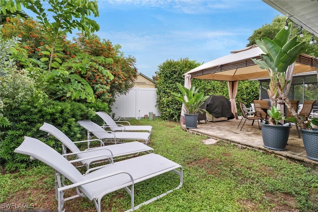 view of yard featuring a gazebo and a patio area