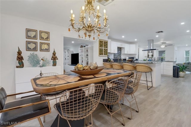 dining room featuring light hardwood / wood-style flooring and ceiling fan