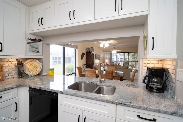 kitchen featuring white cabinetry, sink, decorative backsplash, and dishwasher