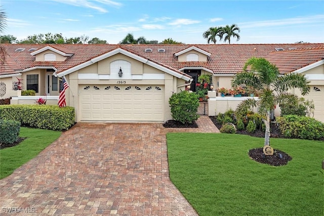 view of front of house featuring a garage and a front yard