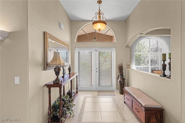 tiled entrance foyer with french doors