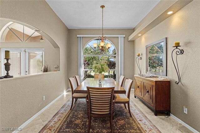 dining area with a notable chandelier and a wealth of natural light