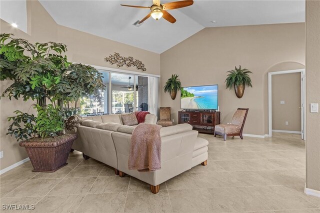 tiled living room with high vaulted ceiling and ceiling fan