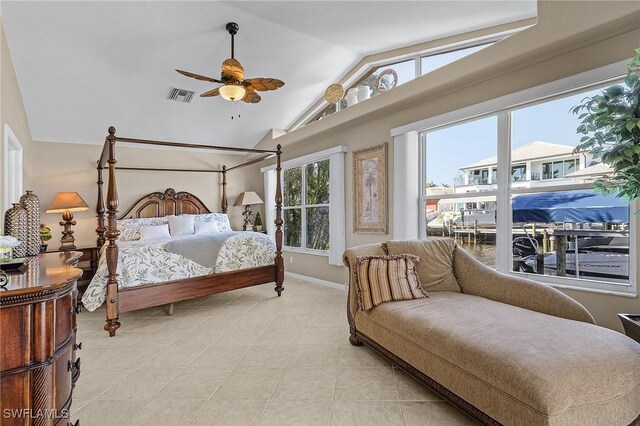 tiled bedroom featuring ceiling fan and lofted ceiling