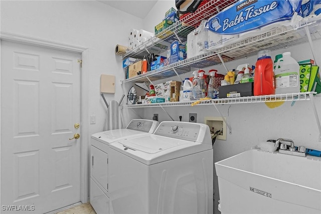 laundry area with sink and washing machine and dryer