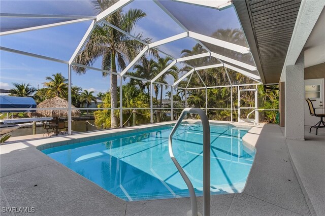 view of pool featuring a lanai and a patio area