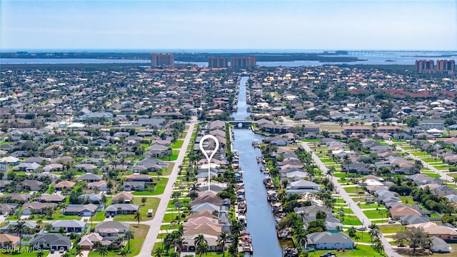 bird's eye view with a residential view and a water view