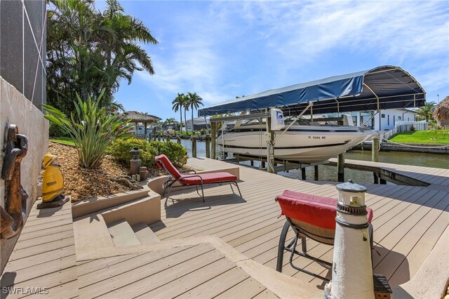 dock area with a water view and glass enclosure