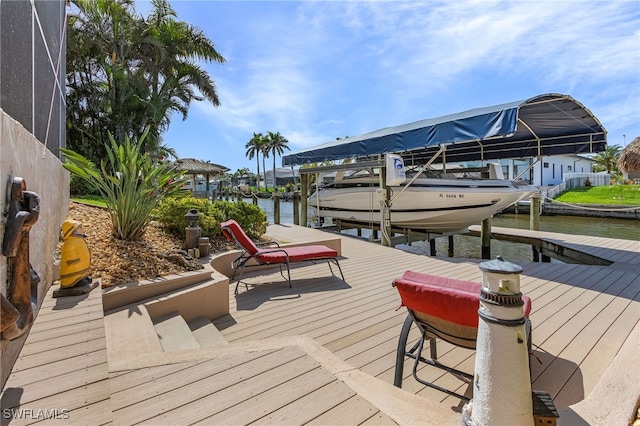 view of dock featuring boat lift and a water view