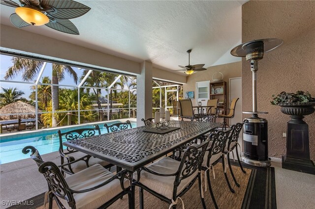 sunroom with vaulted ceiling and ceiling fan