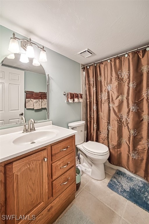 bathroom with vanity, a textured ceiling, curtained shower, tile patterned floors, and toilet