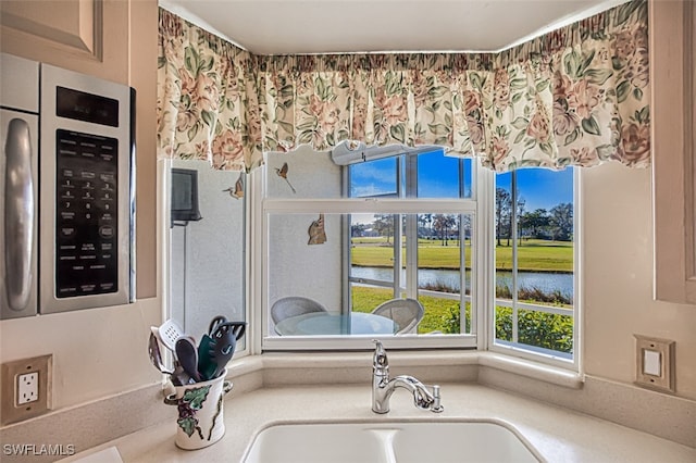 bathroom with sink and a water view