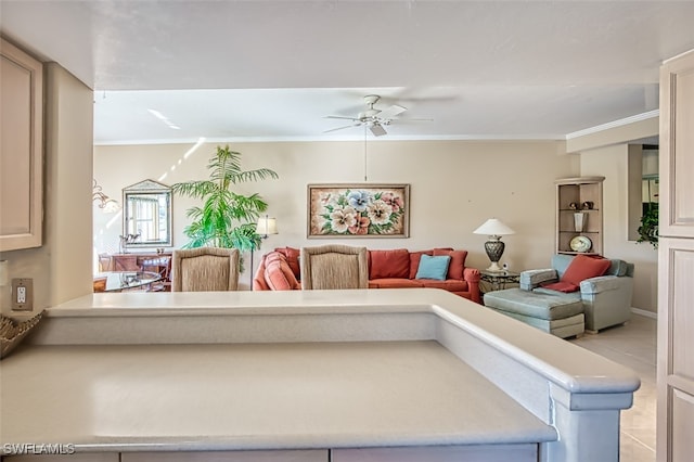 living room with crown molding and ceiling fan