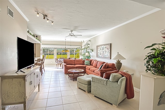 tiled living room featuring crown molding, ceiling fan, and a textured ceiling