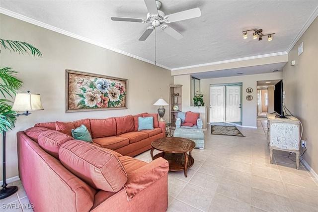 tiled living room featuring ornamental molding, ceiling fan, and a textured ceiling