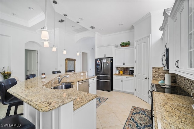 kitchen with a spacious island, a breakfast bar area, pendant lighting, stainless steel appliances, and decorative backsplash